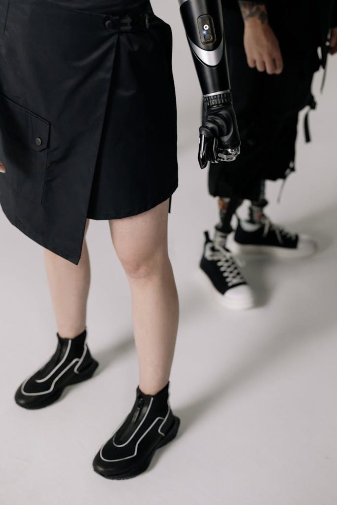 Close-up of stylish modern prosthetics and fashion-forward attire in a studio setting.